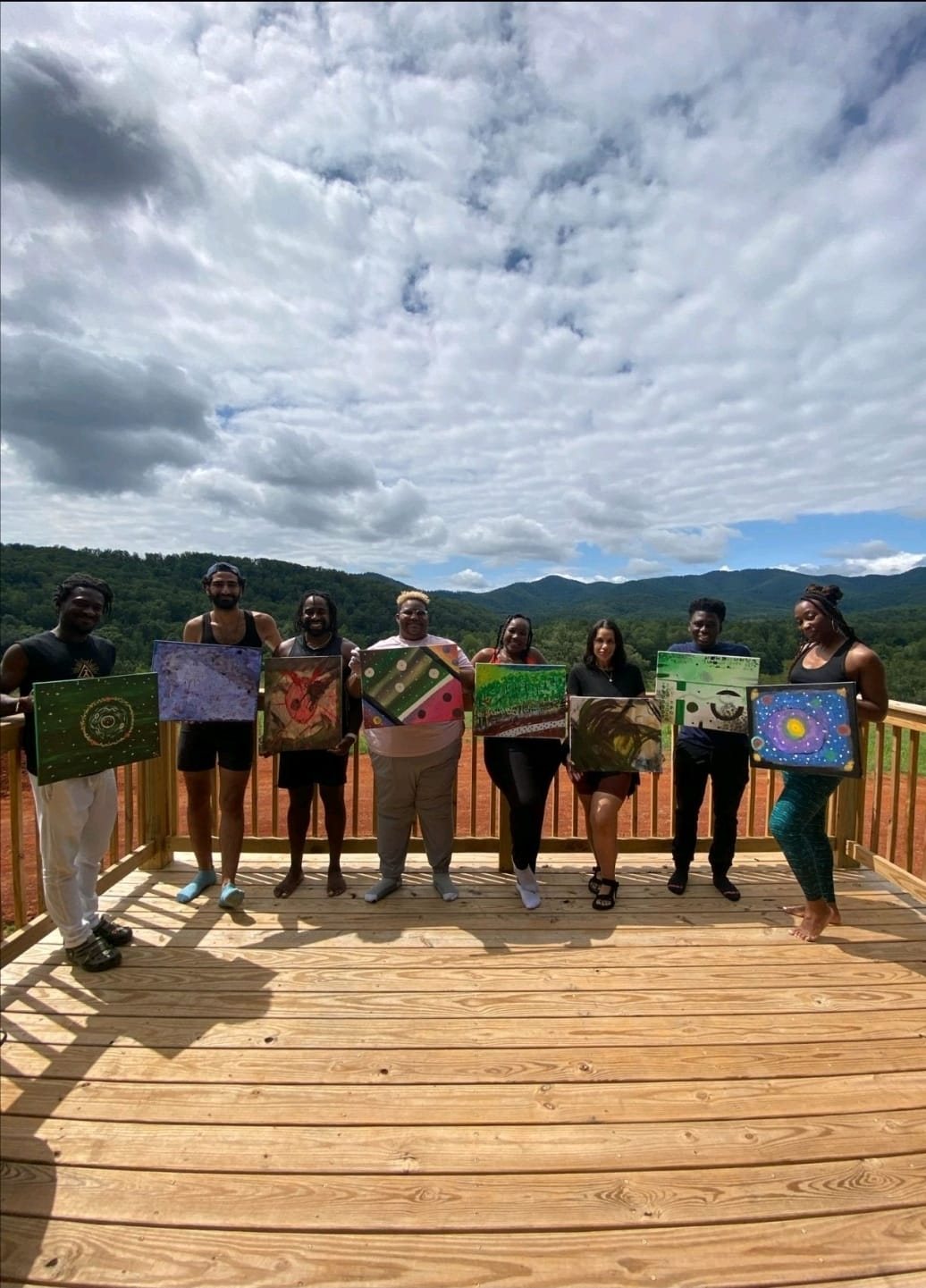 A cohort presents the artwork made during their weeks together