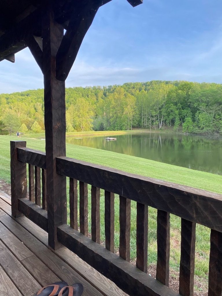 View of the lake from a cabin porch at the Leigheas campus